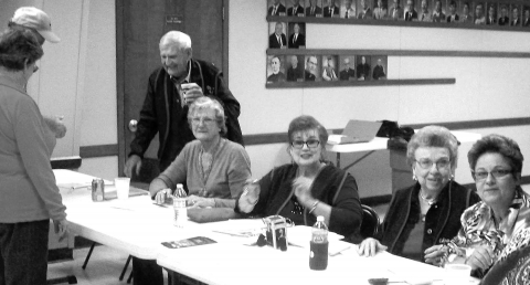 Director Emeritus Carl Wendler (far left) welcomes attendees. Working the check-in desk were (from left) Zelda Walker, Jo Brunner, Edna Mae Psencik and Becky Ermis.