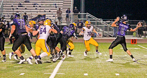 La Grange’s Ty Walker (70) and Cordale Ellison (64) pursue the Navarro quarterback last week. The Leps should have plenty of opportunity for pass rushes this week as Taylor likes to throw the football.